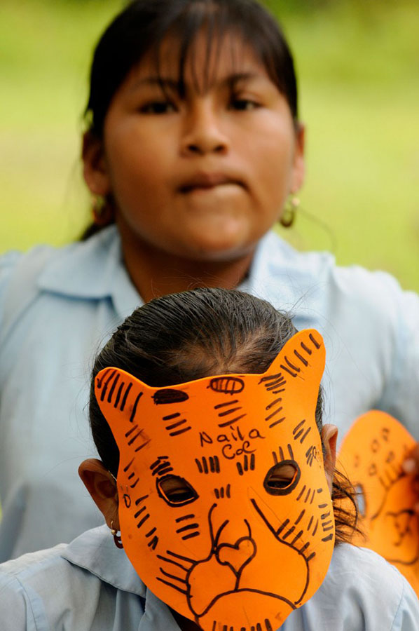 Young girl in jaguar mask