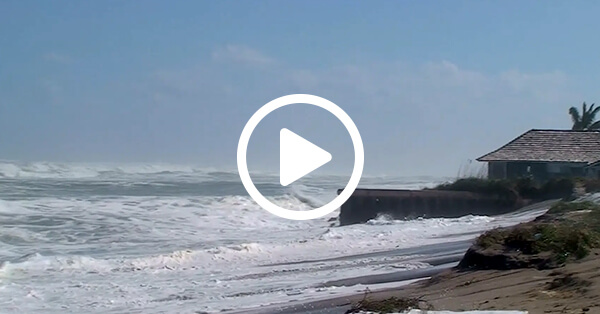 thumbnail of waves breaking on beach wall