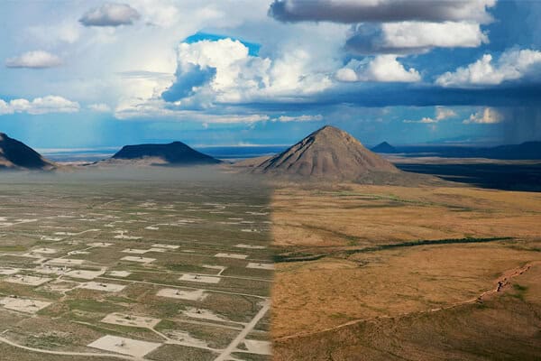 Altered image featuring a scarred oil and gas field blending into an untouched desert landscape