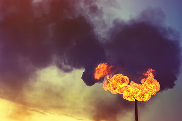 Dramatic oil and gas flare burning